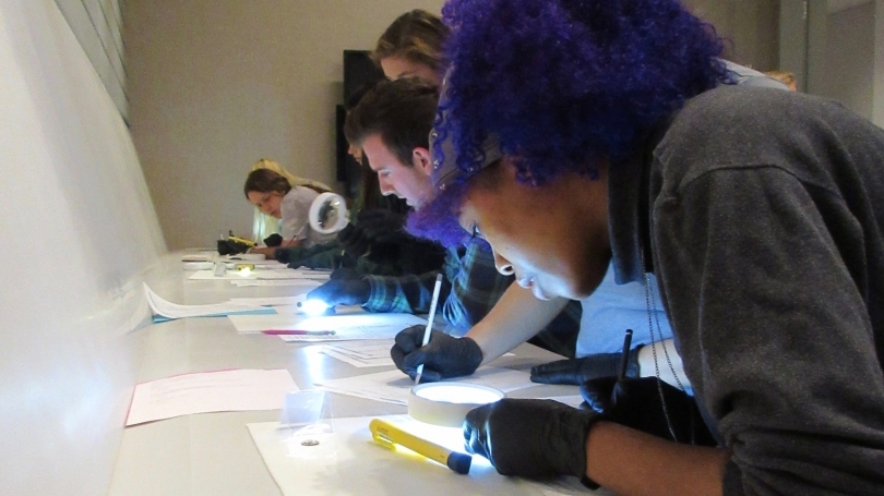 Students examine coins in Hood Museum