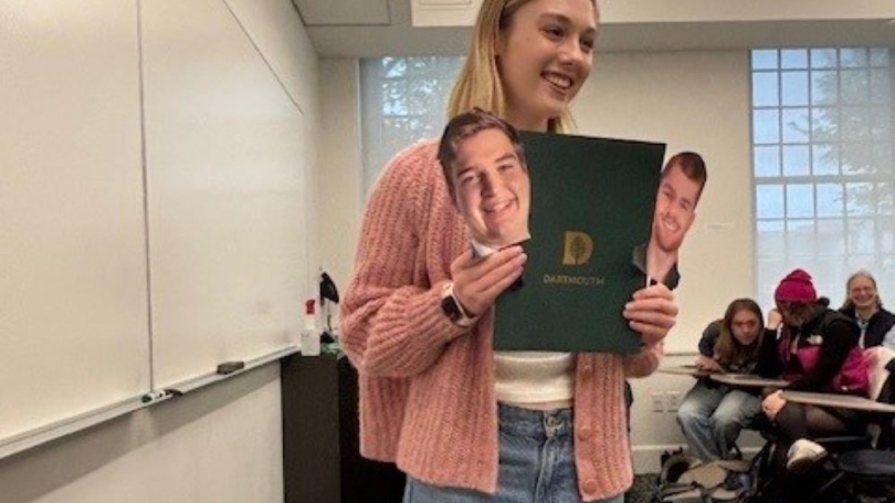 student receives prizes on behalf of classmates